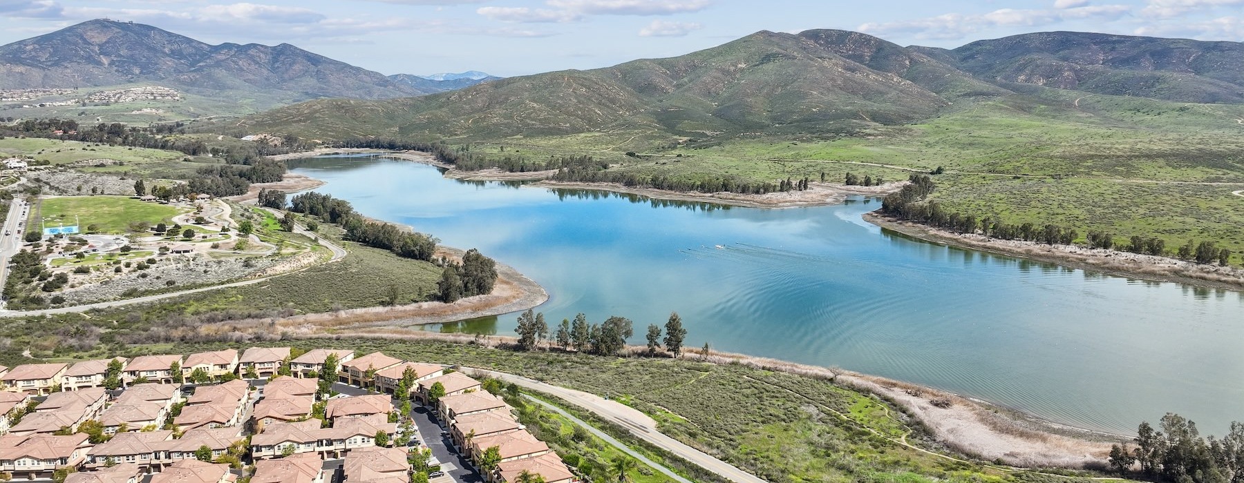 a river with a bridge and buildings