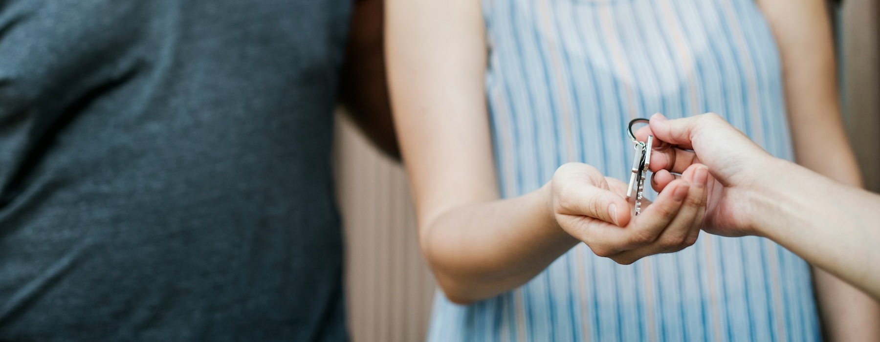 a woman holding keys