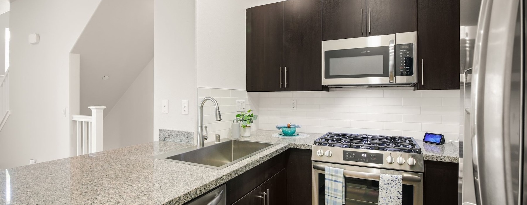 a kitchen with black cabinets