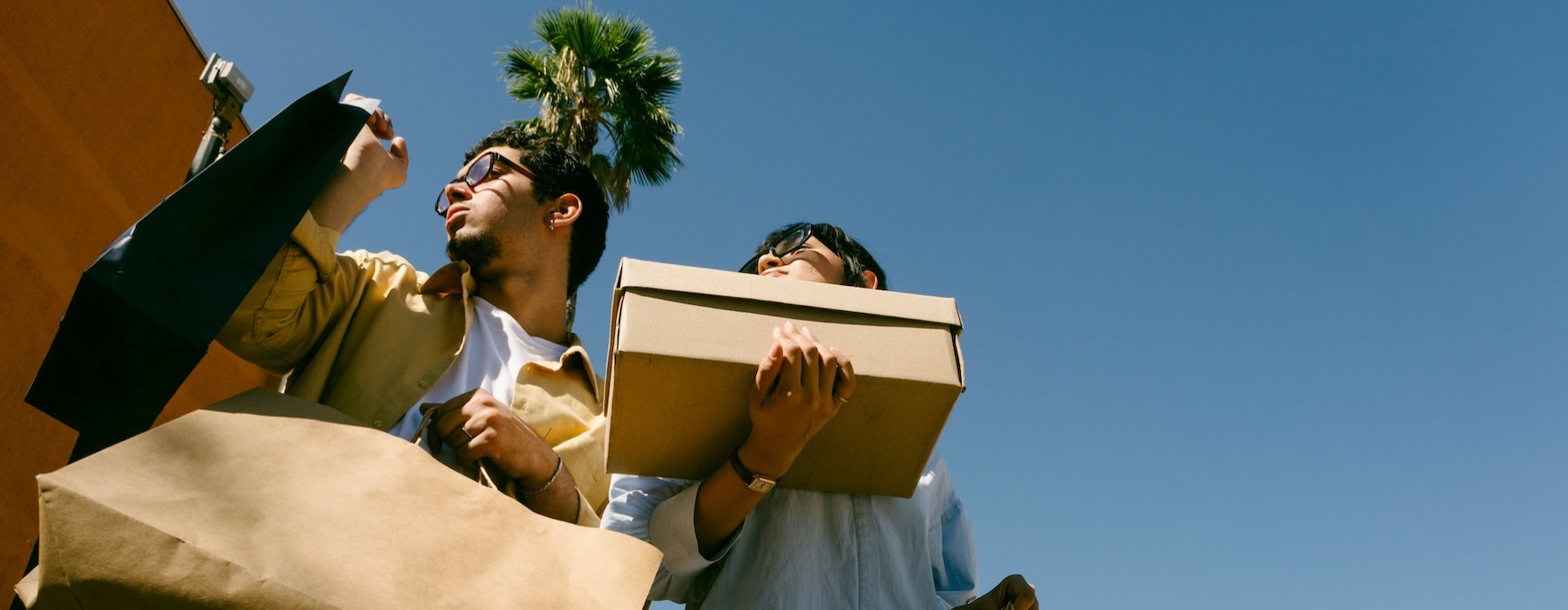 a man and woman holding a box